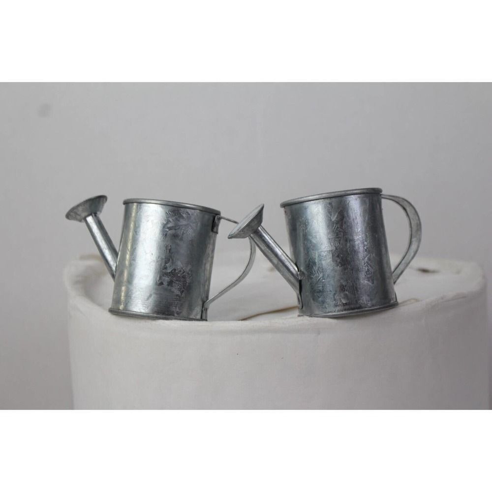 Two small tin watering pot candles